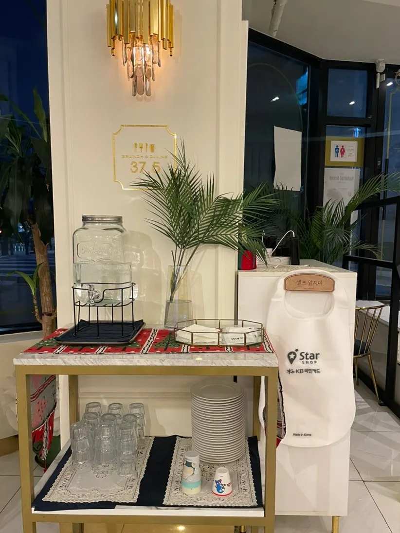 Self-serve bar with water and aprons