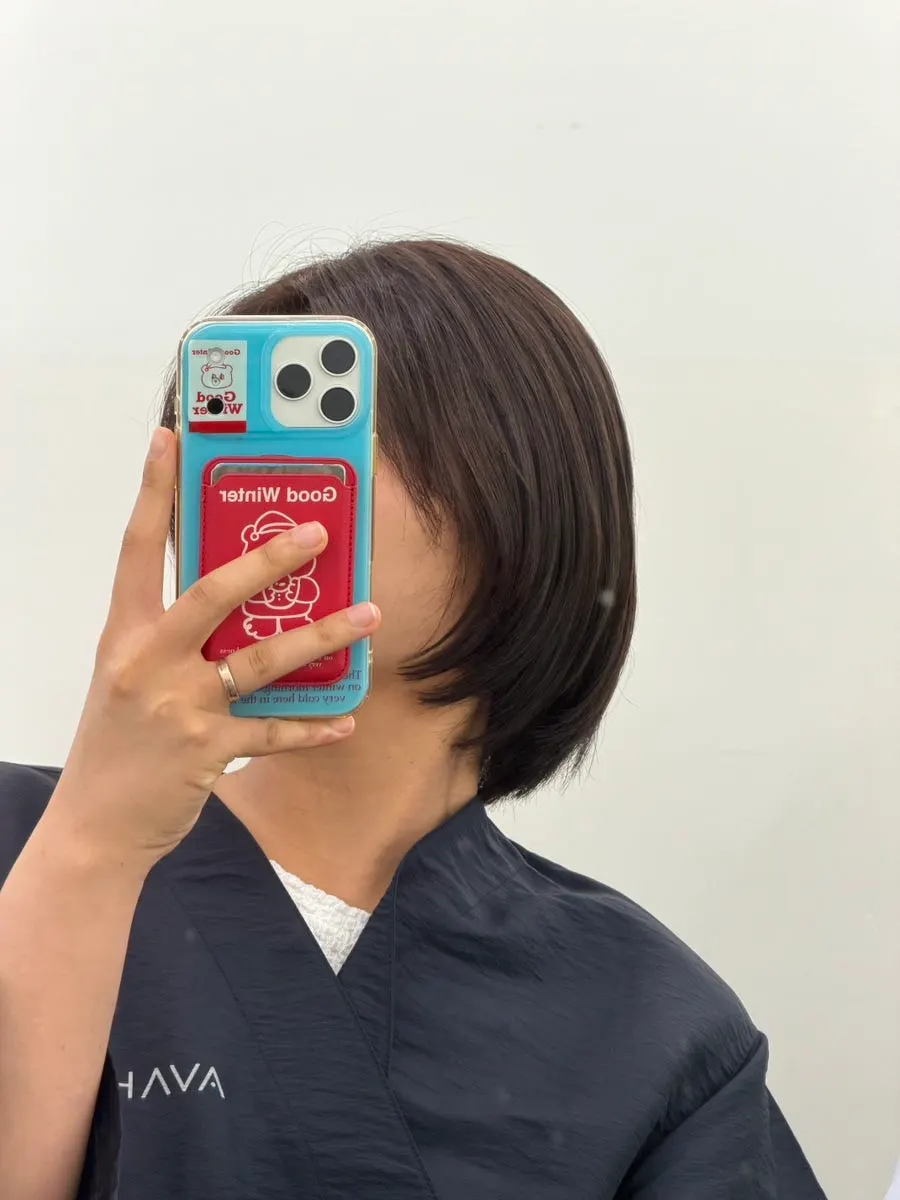 Mid-length style after cutting, shampoo, and blow-dry