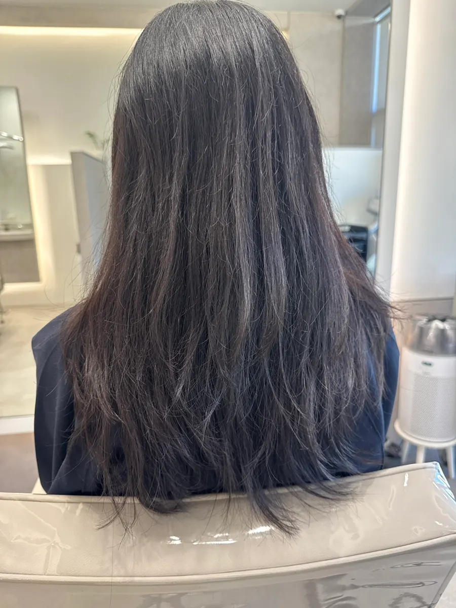Long, frizzy curly hair before the service