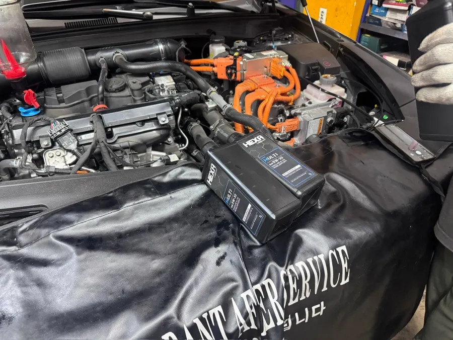 Pouring in the new Hexa Multi Synthetic oil
