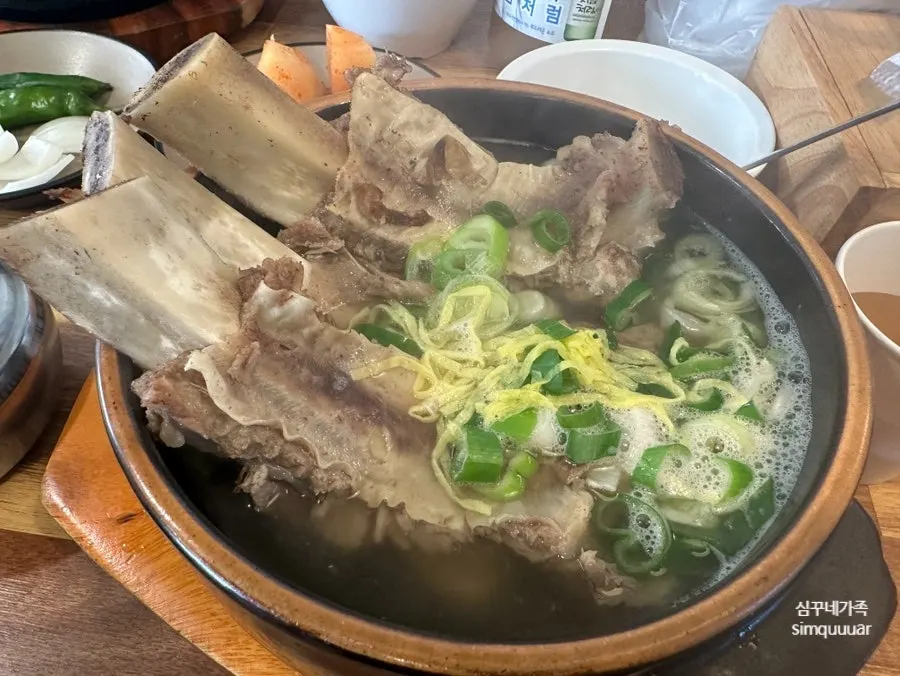 Chopsticks pulling tender rib meat off the bone