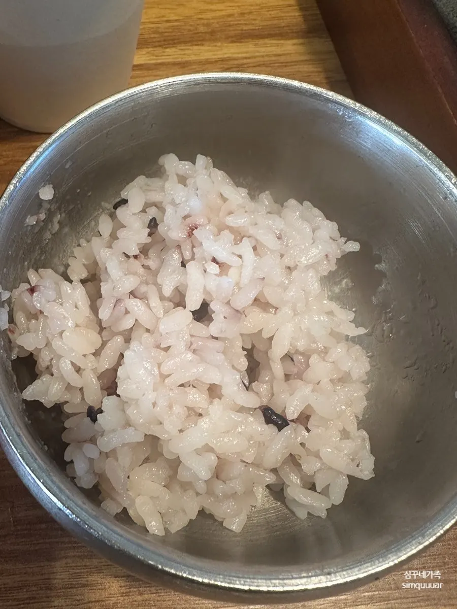 Vertical shot of the galbitang table setting with rice refills