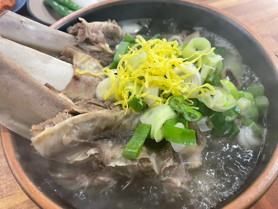 Clear galbitang broth with glass noodles and mushrooms