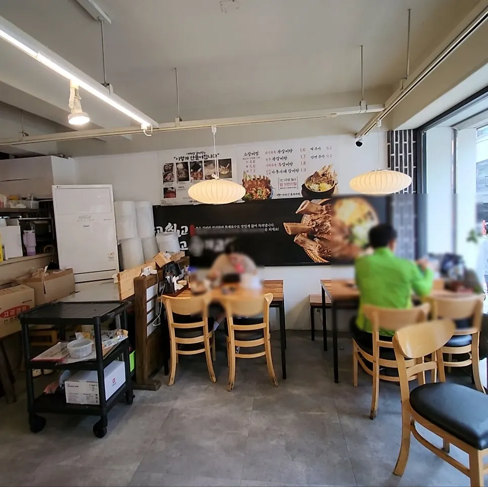 Dining hall with generously spaced tables at Achasan Tong Galbitang