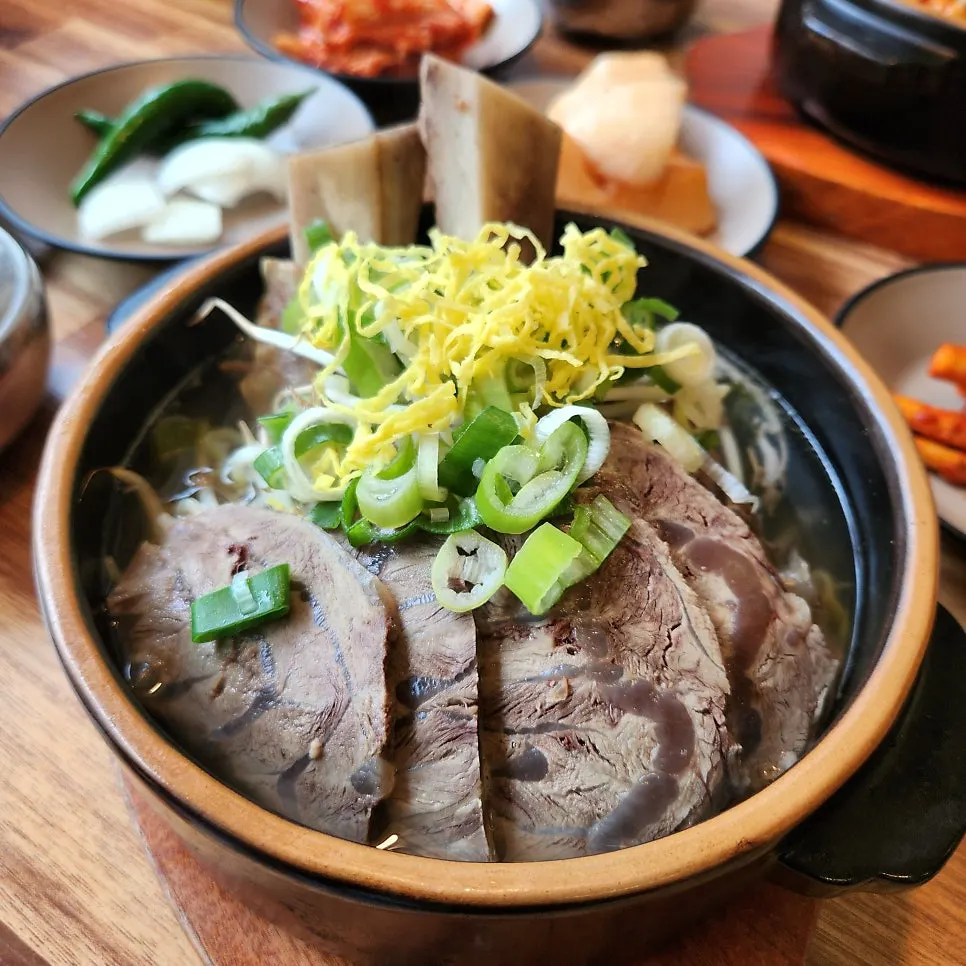 Beef shank galbitang simmering in a stone pot