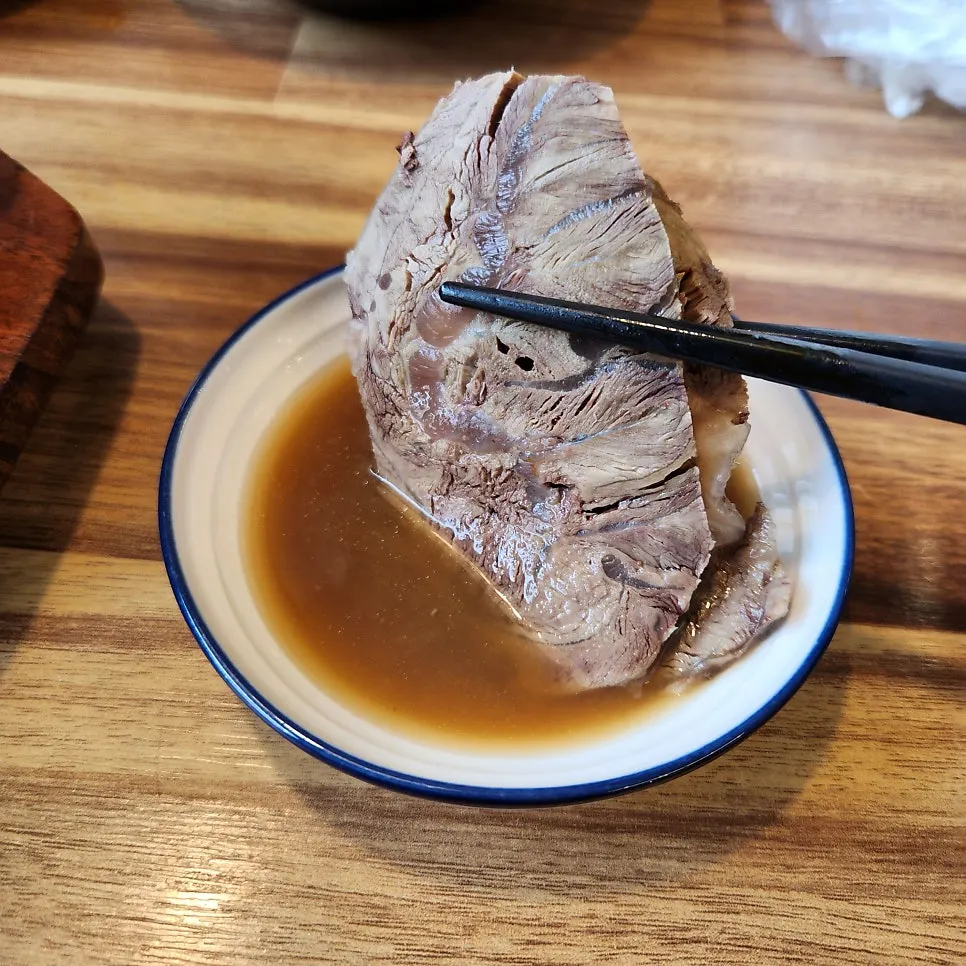 Beef shank dipped in mustard sauce