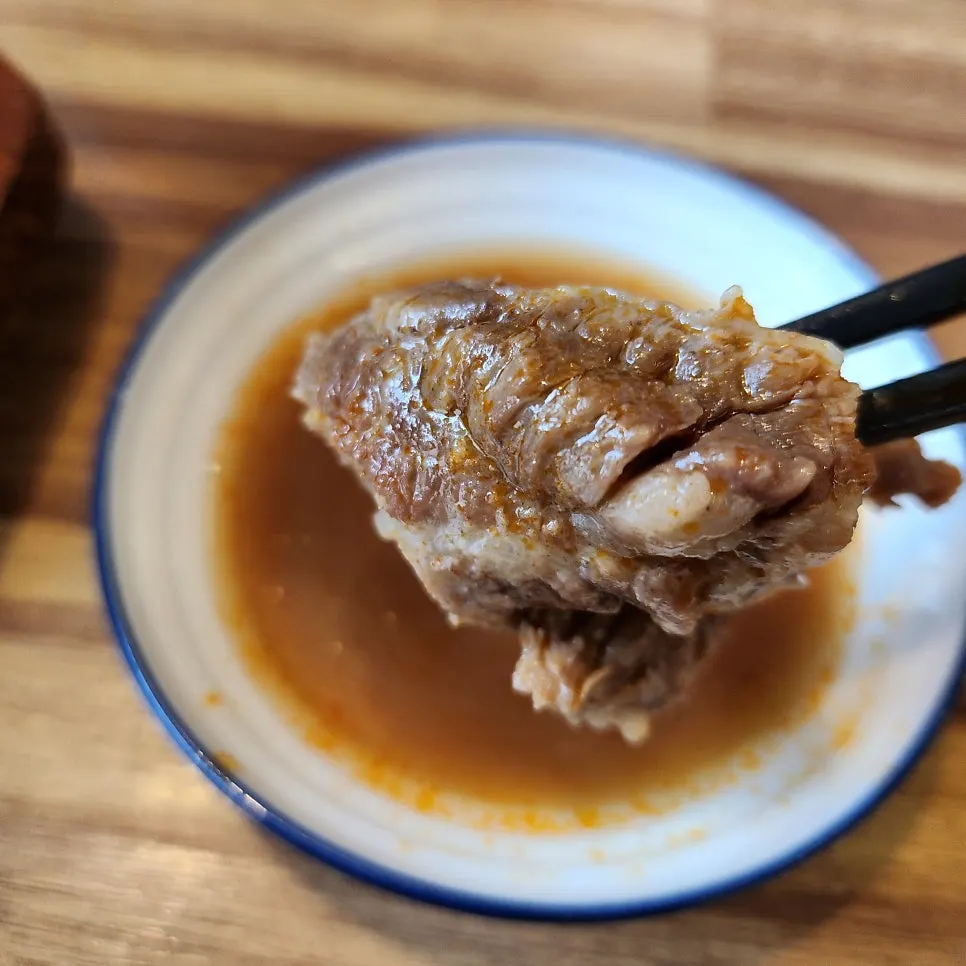Two bowls: beef shank galbitang and spicy king galbitang