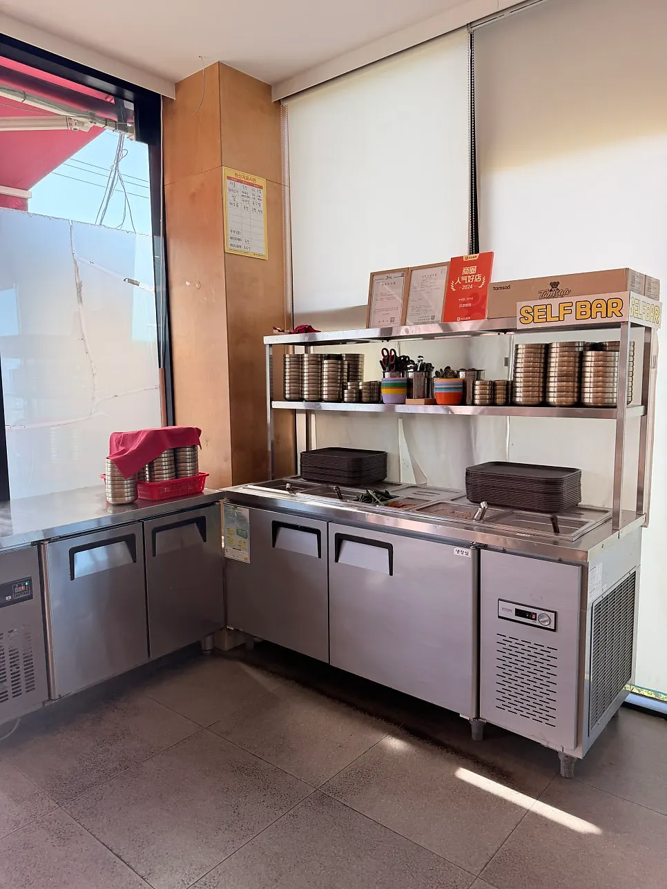 Self-service bar with extra tableware and side dishes