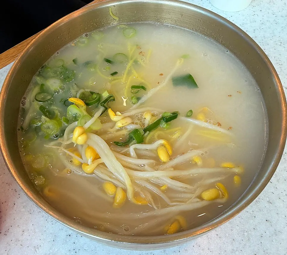 A bowl of beef-bone-broth noodles topped with dombe pork