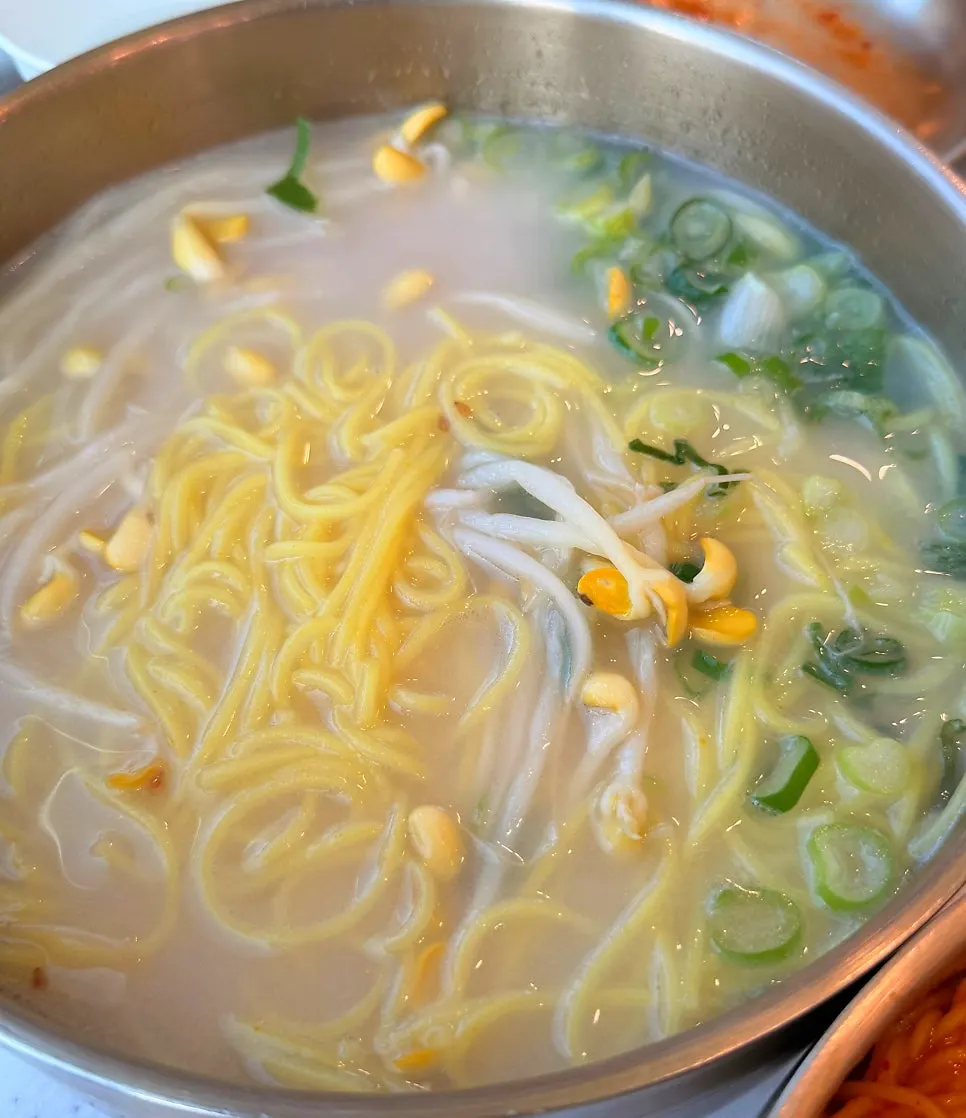 The combination of bibim guksu and beef-bone-broth noodles