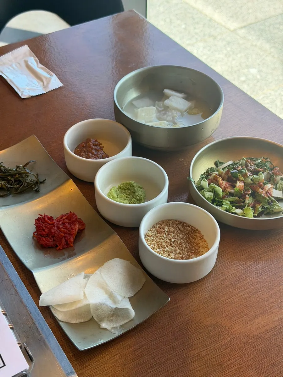 Table set with side dishes and three sauces