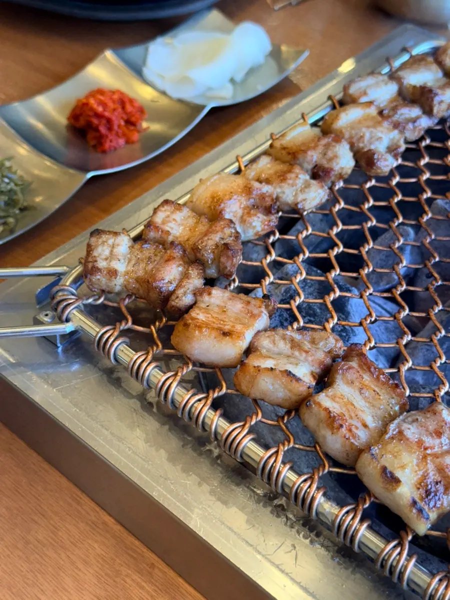 Staff grilling black pork at Nopo Dwaeji
