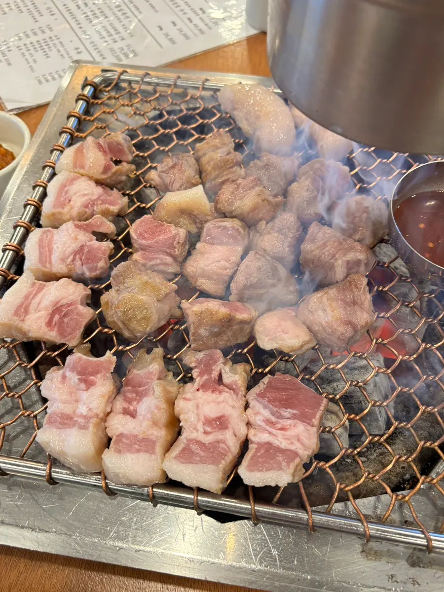 Smoke rising from the charcoal during grilling