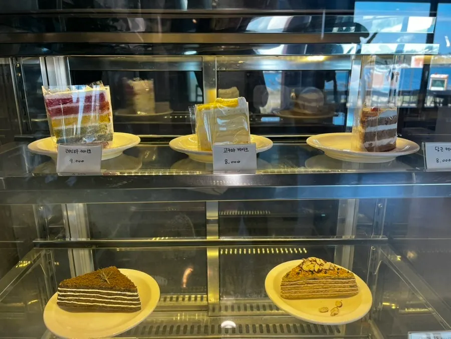 Display of what look like house-made scones and desserts