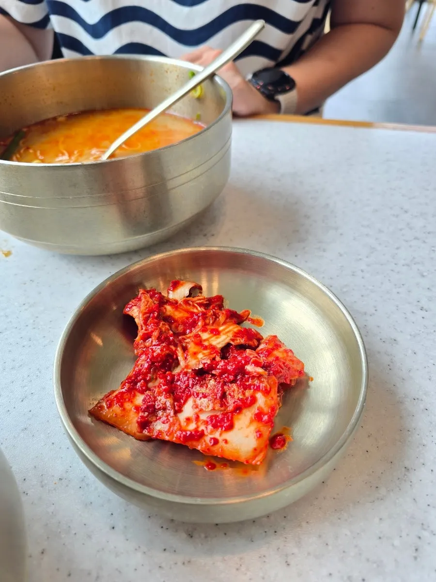 Kimchi and basic side dishes at the self-serve bar