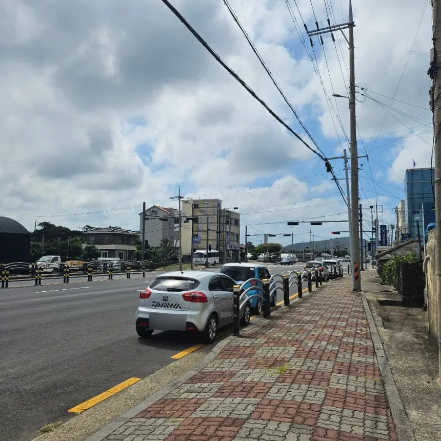 Front of the Aewol Eomma building with a parked car
