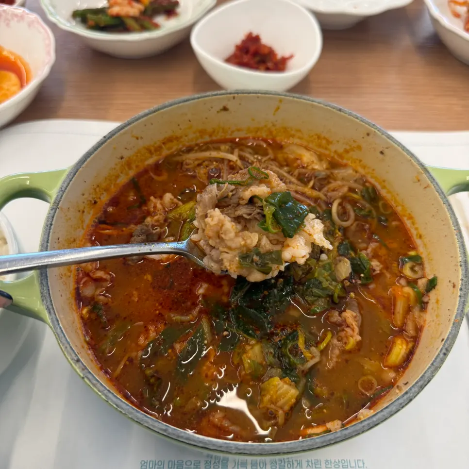 Broth from Aewol Eomma Hangover Soup showing brisket and shank pieces
