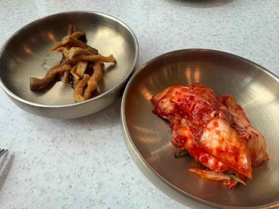Kimchi and radish jangajji taken from the self-serve bar