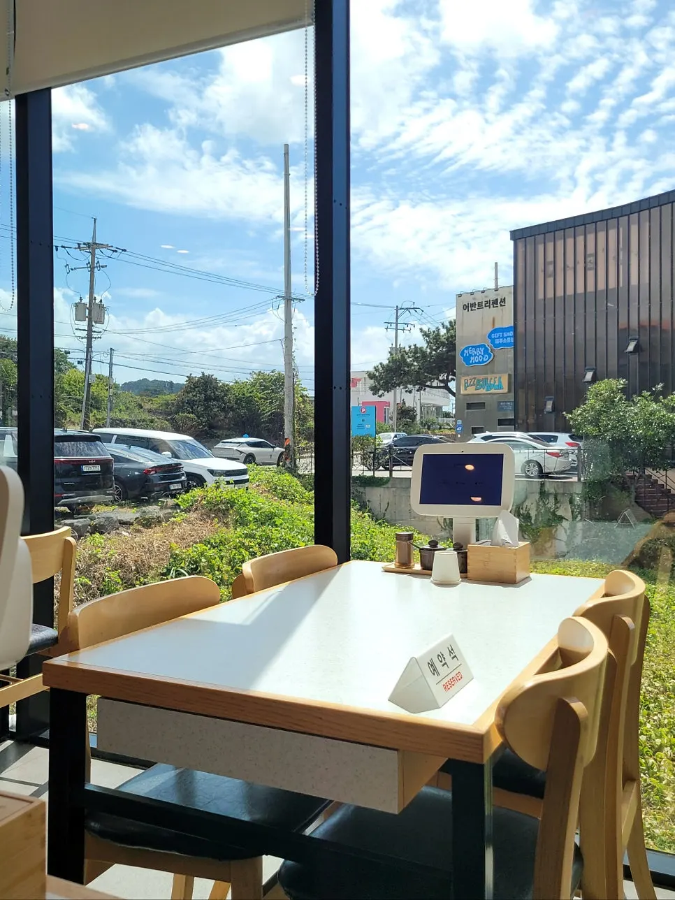 Interior seating at Handam Guksu with floor-to-ceiling windows