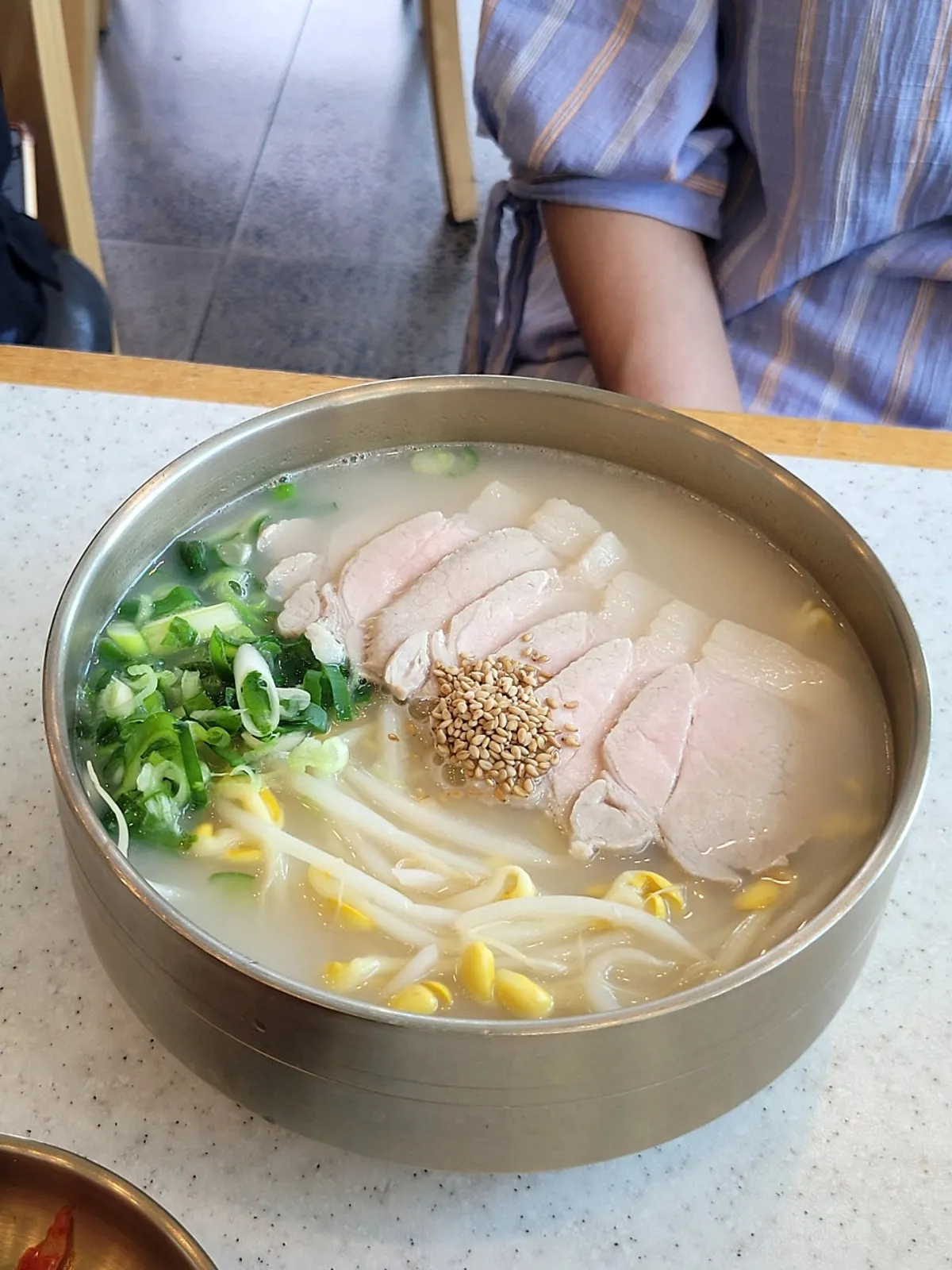 Bone broth pork noodles topped with bean sprouts and meat