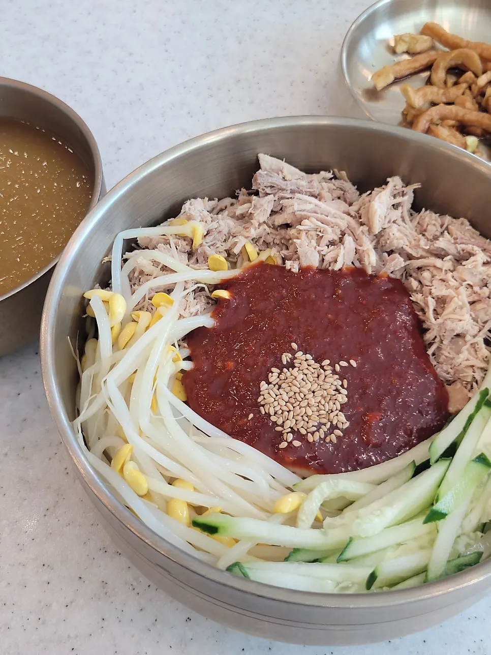 Spicy sauce on top of the bibim noodles