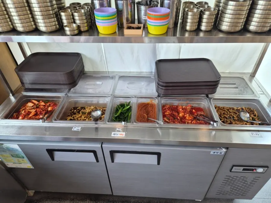 Self-serve bar with kimchi and ssam peppers