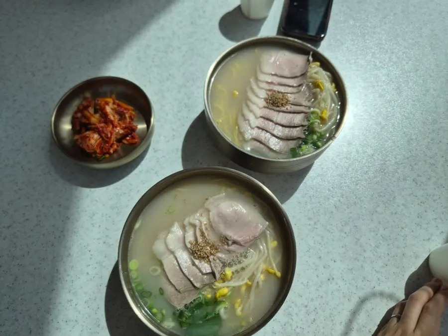 Plate of kimchi and side dishes from the self-serve bar