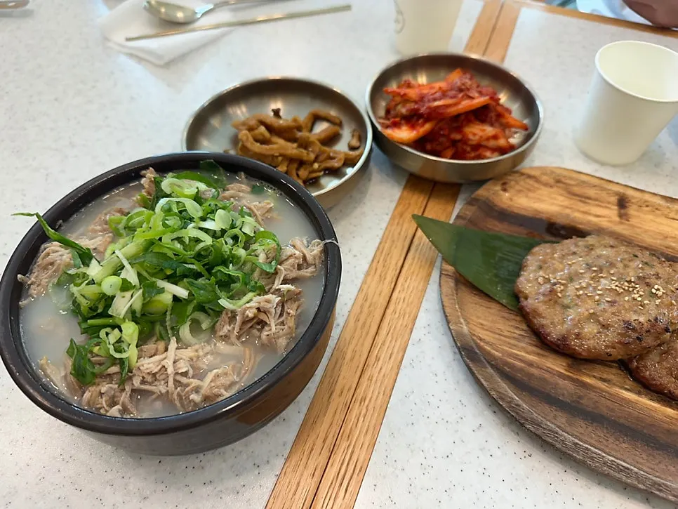 Full spread of lean pork rice soup, bibim noodles, and tteokgalbi