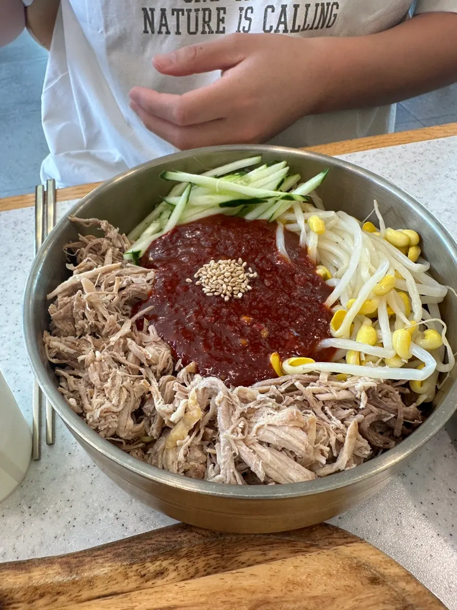 A large bowl of dongchimi bibim noodles