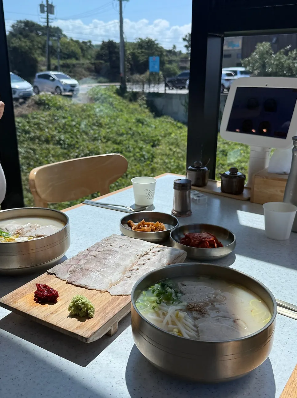 Pork noodle meal served with an ocean view