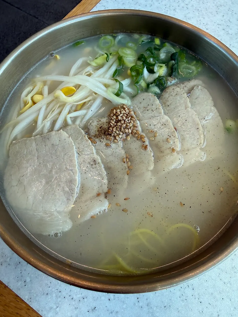 Pork noodles with bean sprouts and scallions