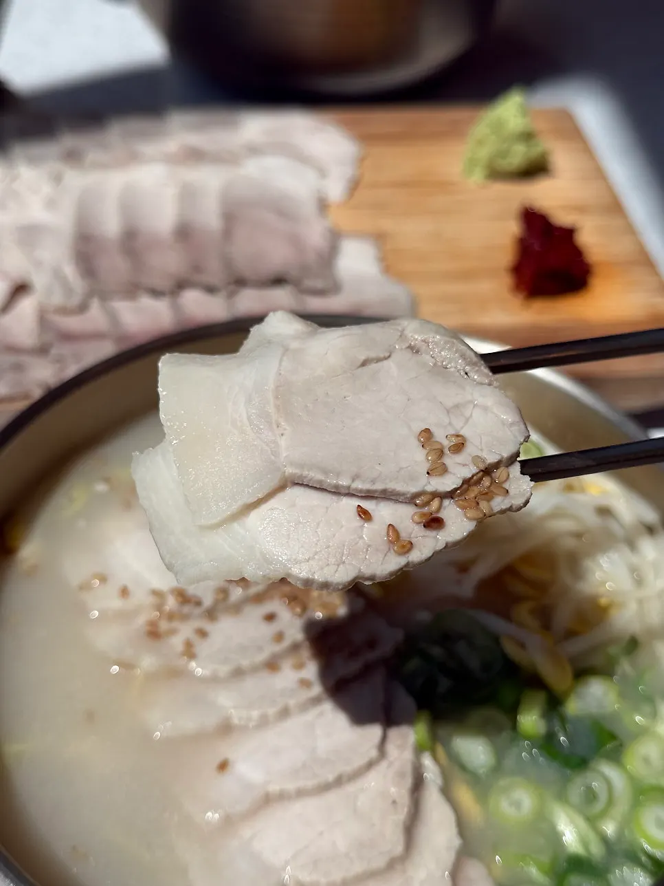 Noodles topped with pork