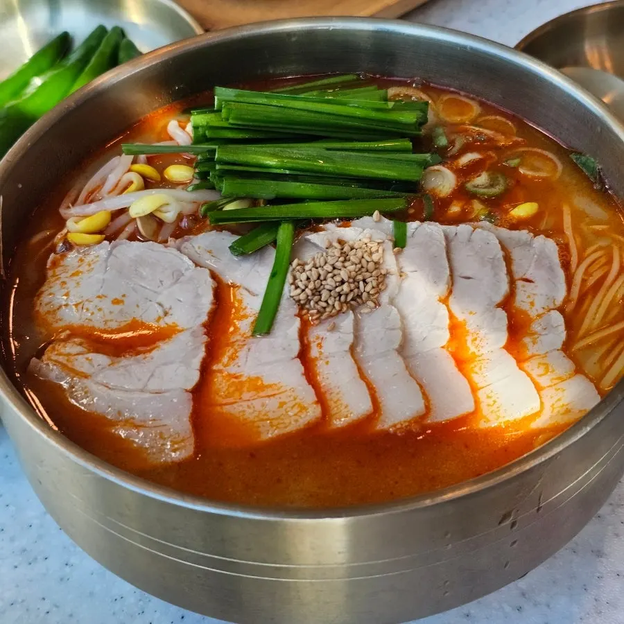 Close-up of the rich bone-broth pork noodle soup