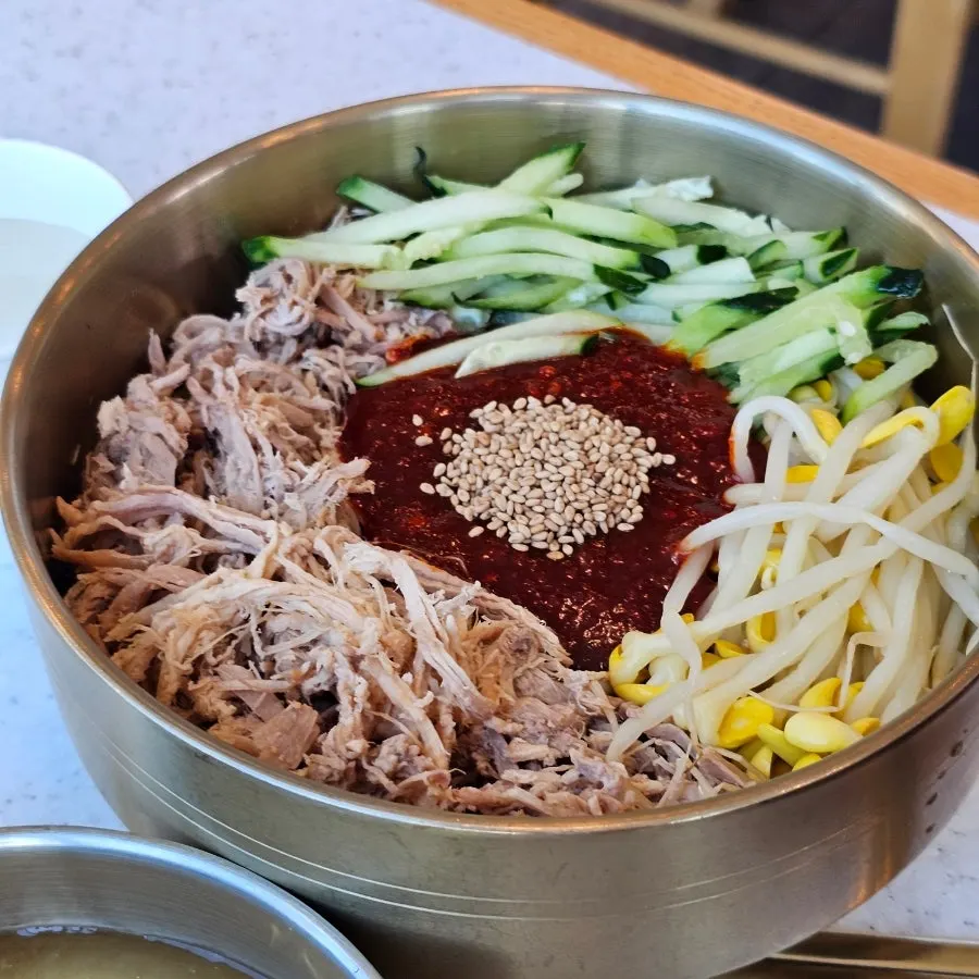 Noodle dishes set on the ocean-view window table