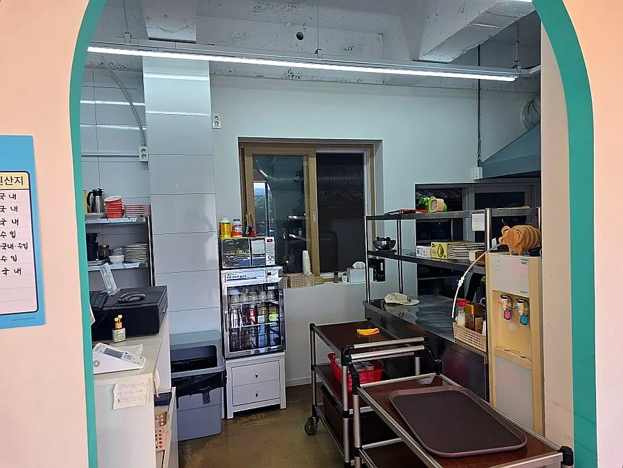 Interior of Aewol Eomma with signage about Korean beef bone broth