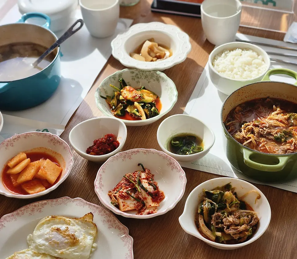 Family breakfast table with hangover soup and beef radish soup together