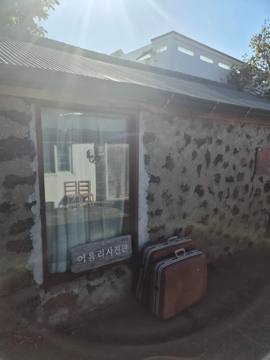 Standalone Eoeum-ri Photo Studio building set behind the stone wall