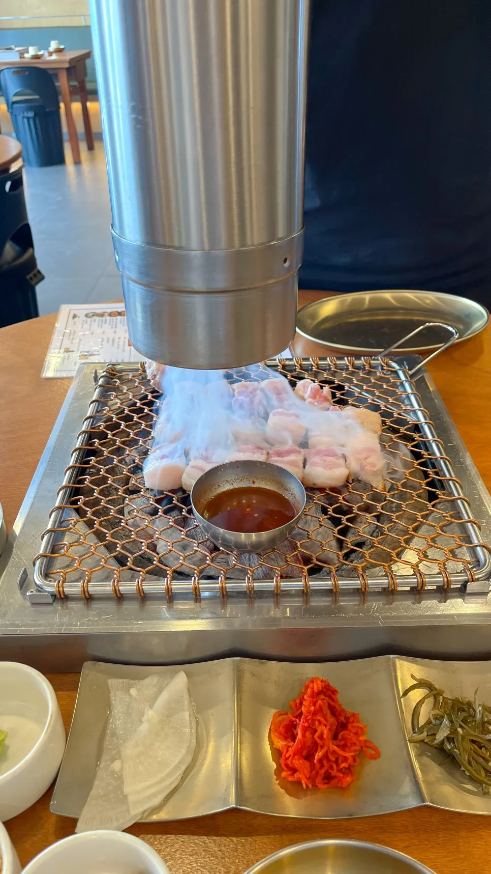 Jeju black pork geun-gogi grilled by a staff member