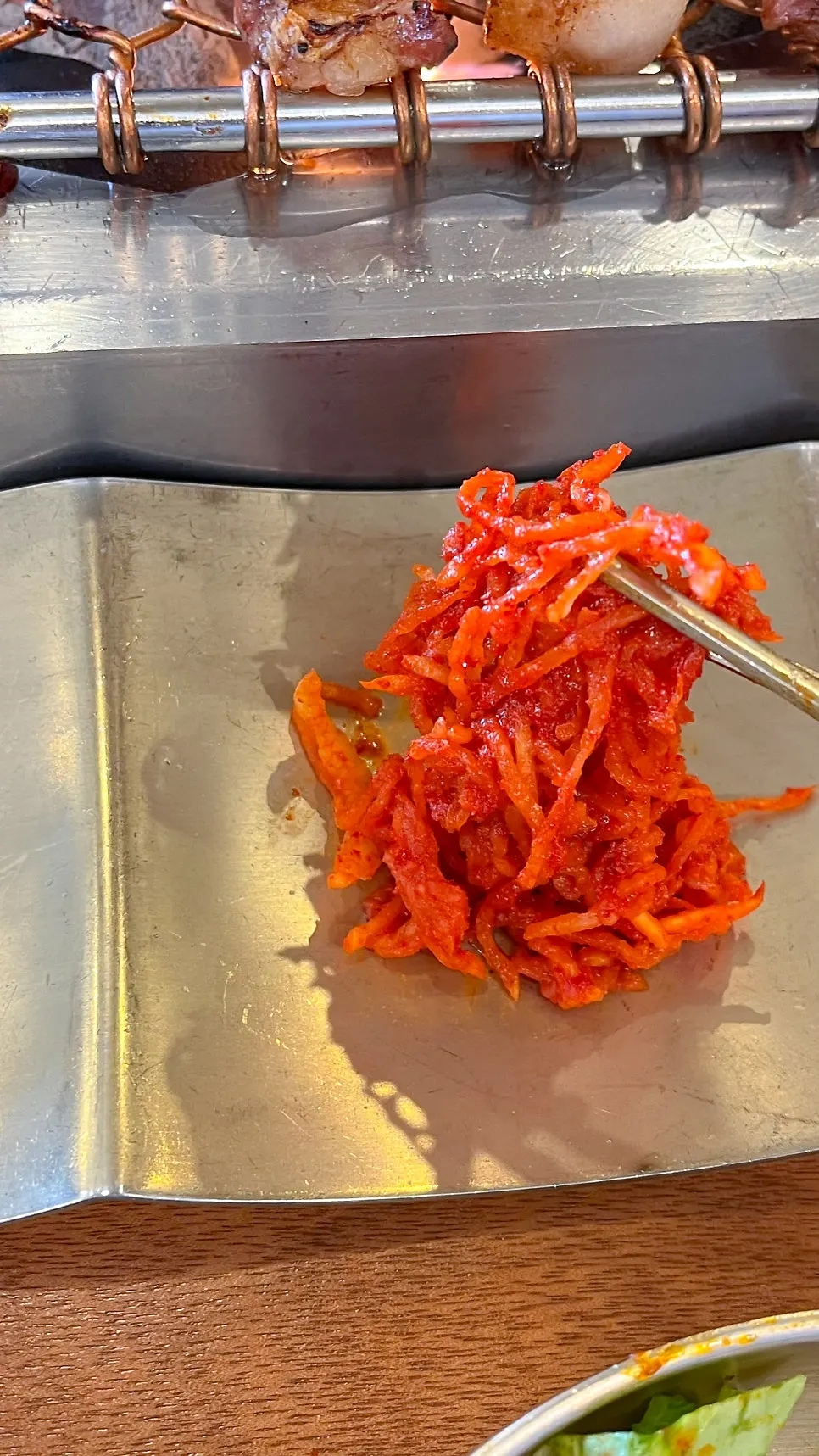 A side dish resembling red shredded radish