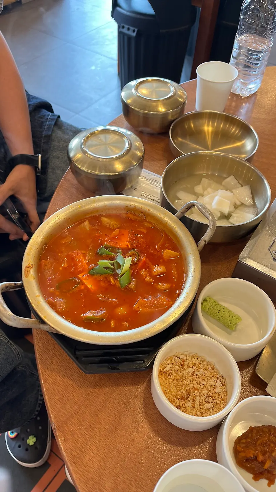 Kimchi stew served alongside black pork