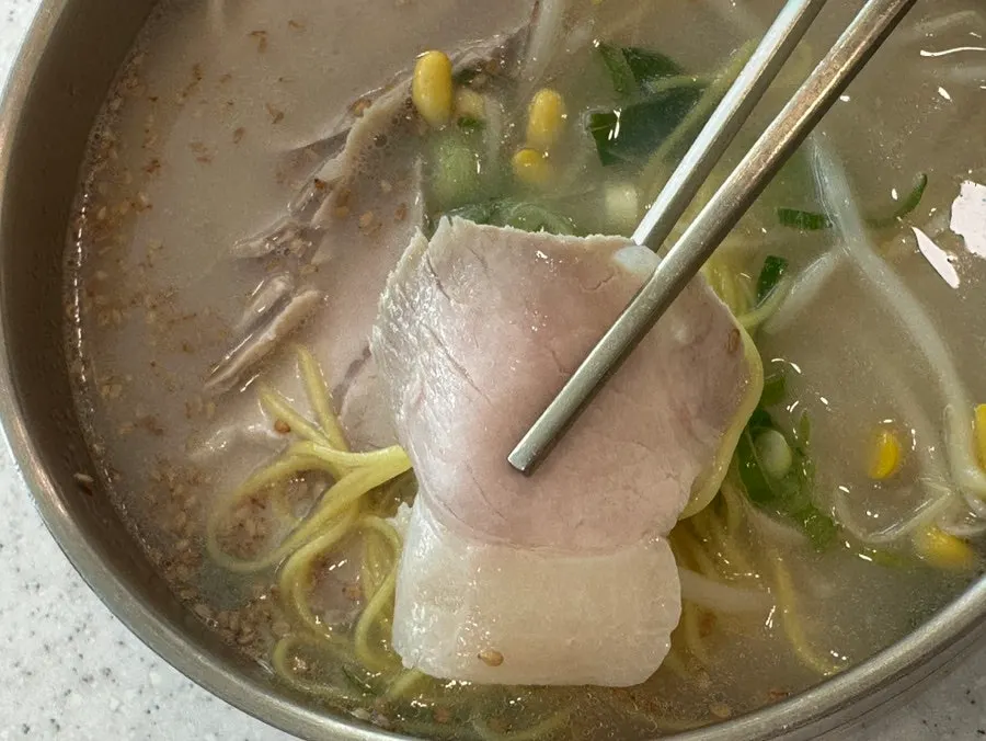 Close-up of the generous pork noodle soup portion