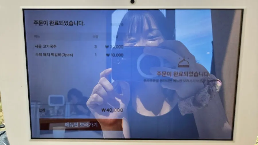 Tablet kiosk ordering screen at the table