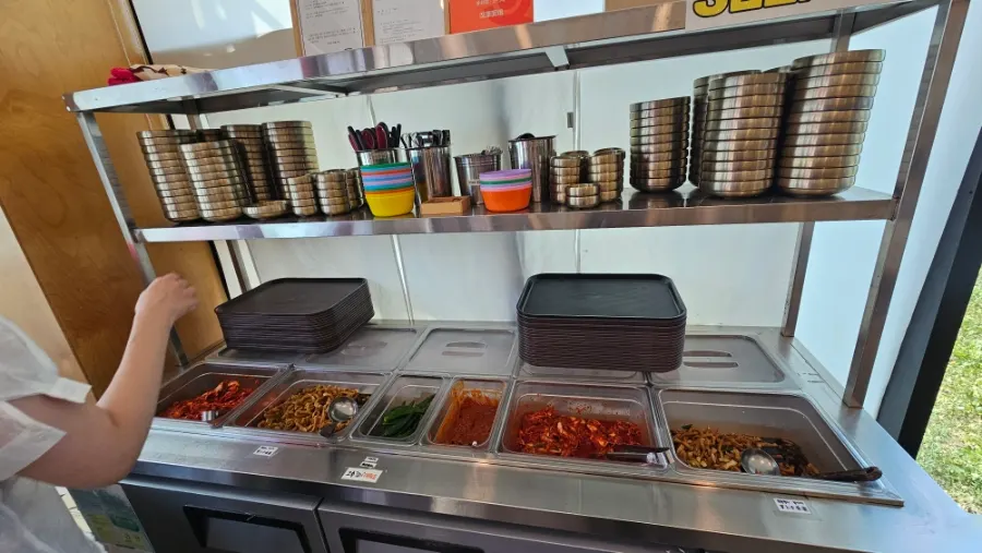 Self-serve bar with side dishes and tableware
