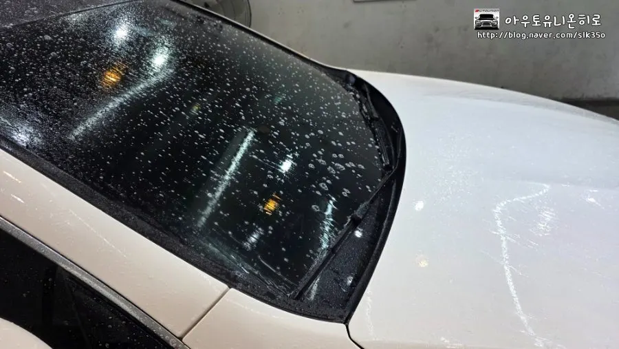 Applying alkaline pre-wash to a vehicle's painted surface