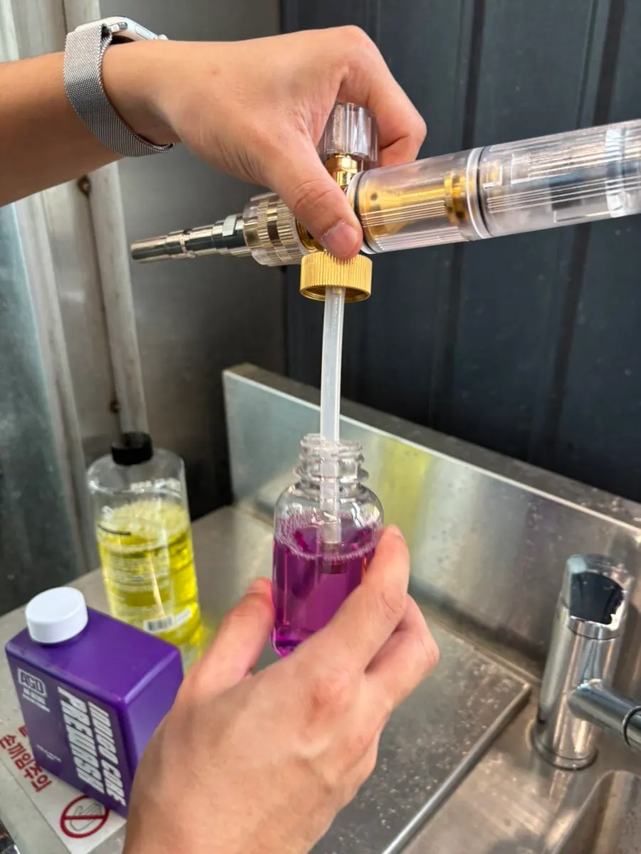Alkaline pre-wash being prepared for use with a foam lance