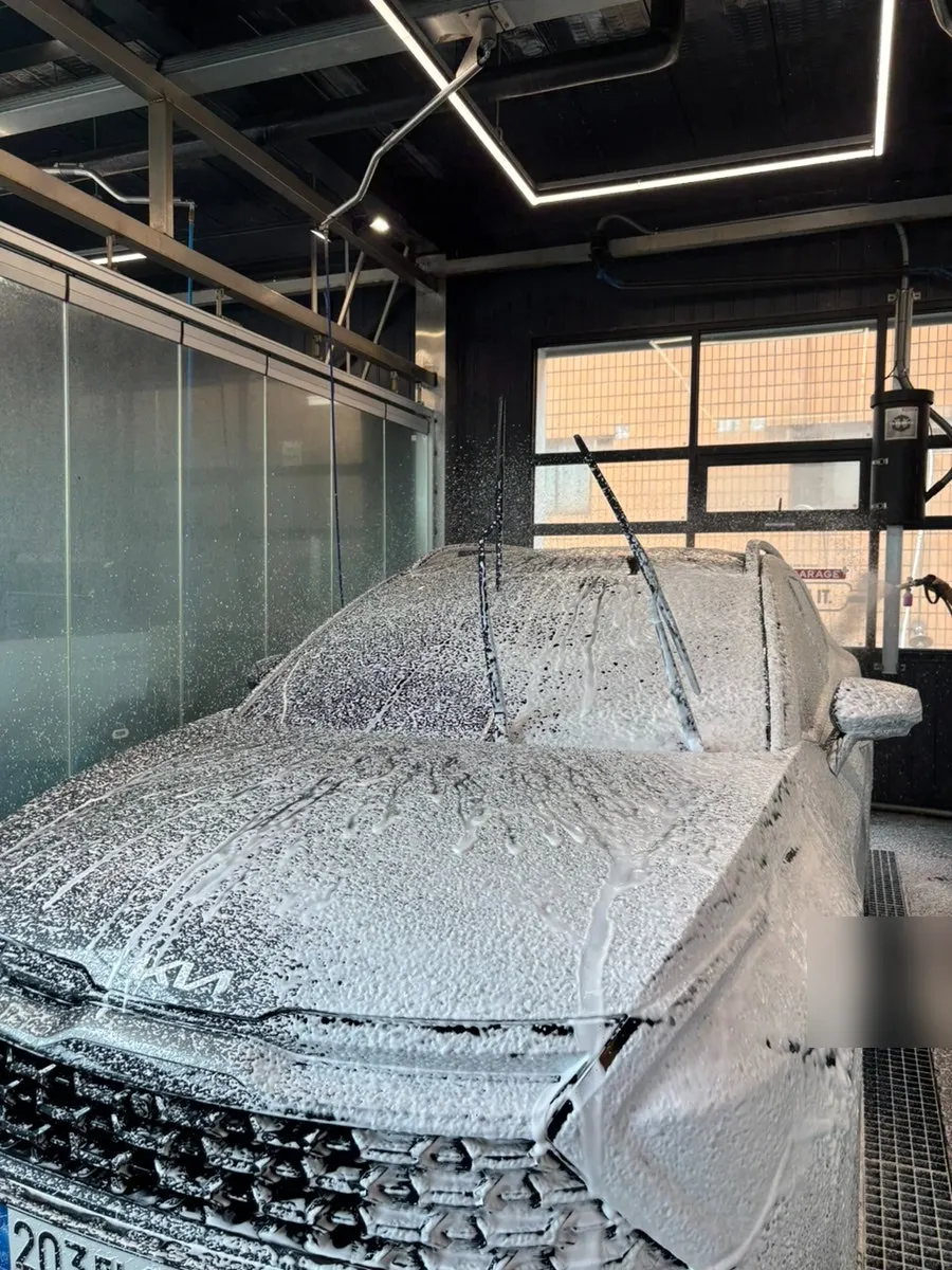 Dense alkaline pre-wash foam on a car