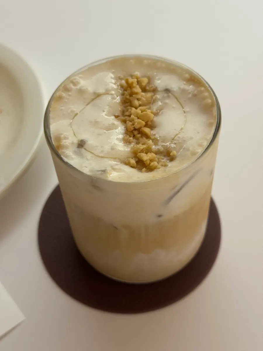 Signature Tak Latte topped with peanut cream