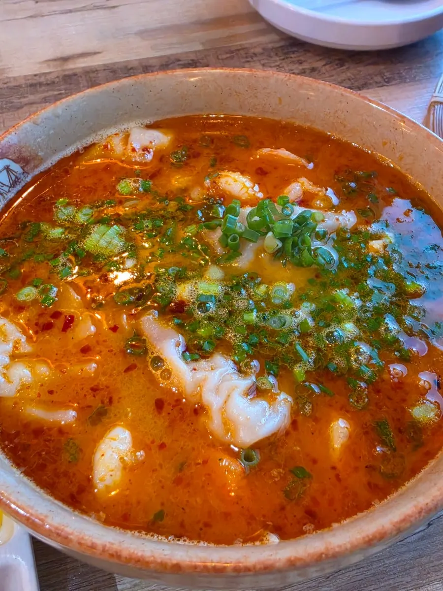 Tom yum pho and bun cha laid out together at Madam Hao