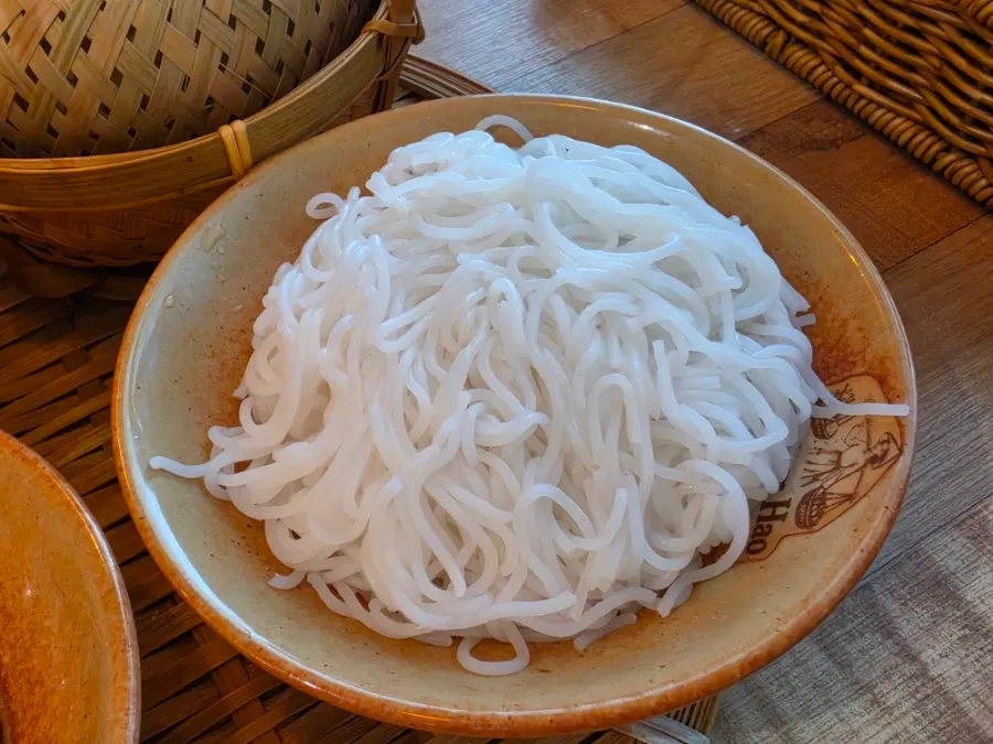A plate of fresh vegetables served alongside bun cha