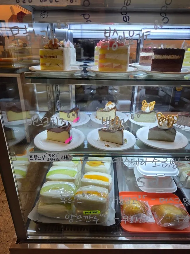 Table spread of decaf iced Americano and fig cake